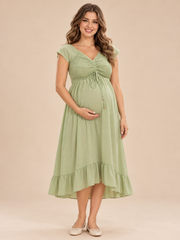 Juniper Sage Green maternity dress — front view with smocked V-neck bodice and ruffled midi hem