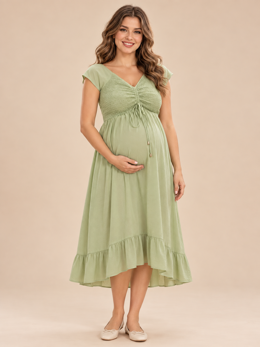 Juniper Sage Green maternity dress — front view with smocked V-neck bodice and ruffled midi hem
