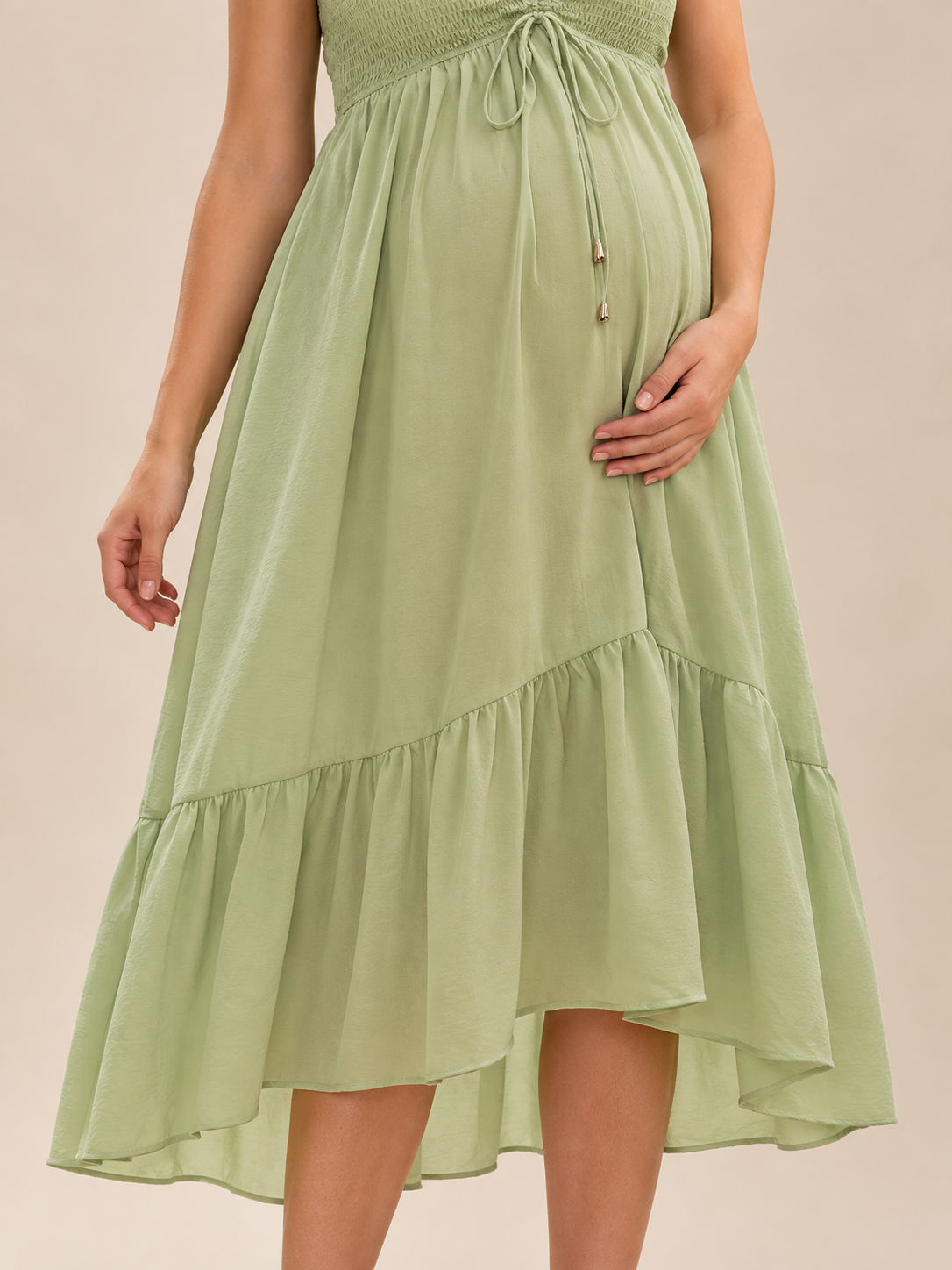 Juniper Sage Green maternity dress — asymmetric ruffle hem and skirt detail