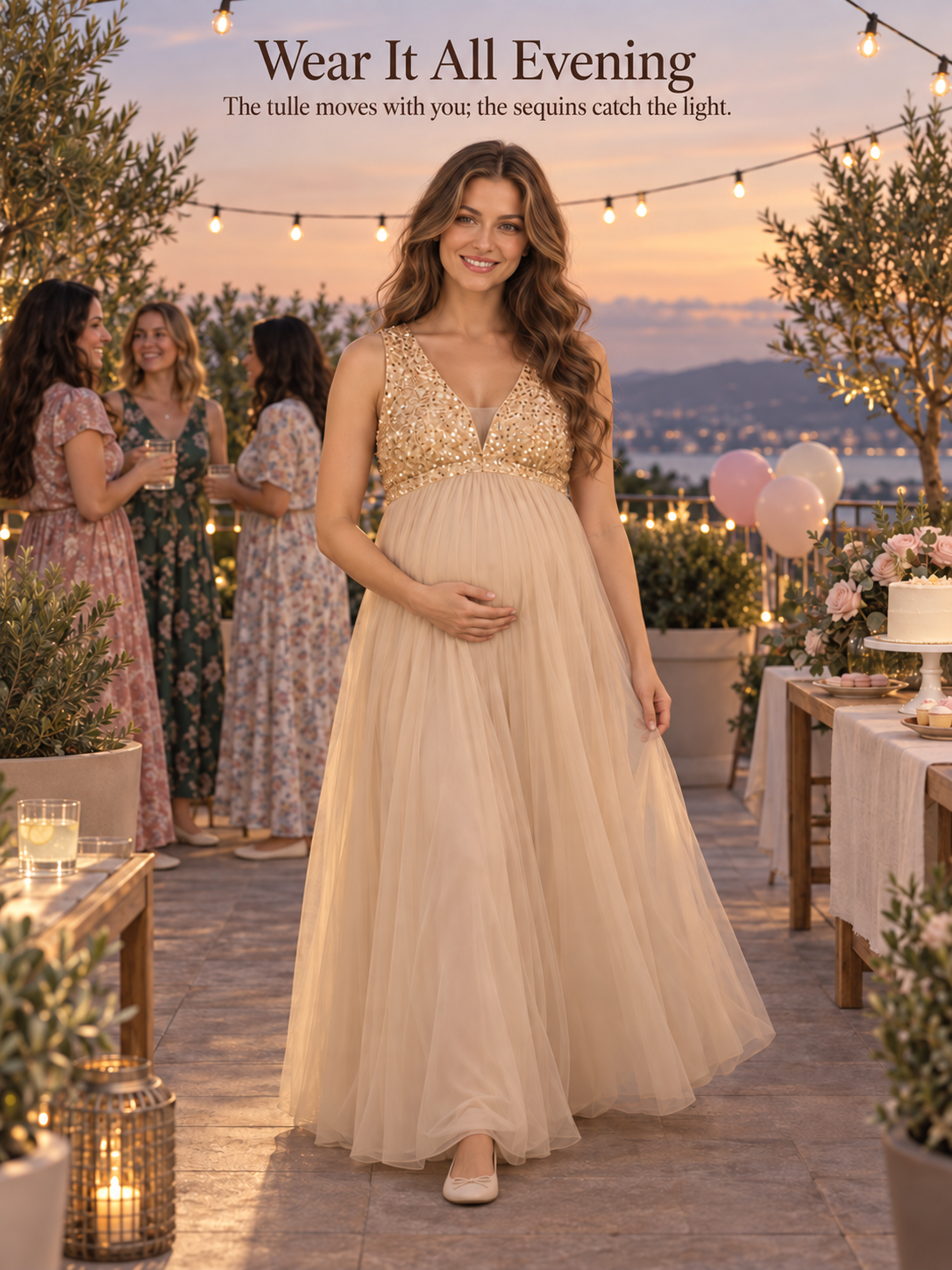 Ottilie Champagne Gold maternity dress — evening celebration on a terrace under string lights