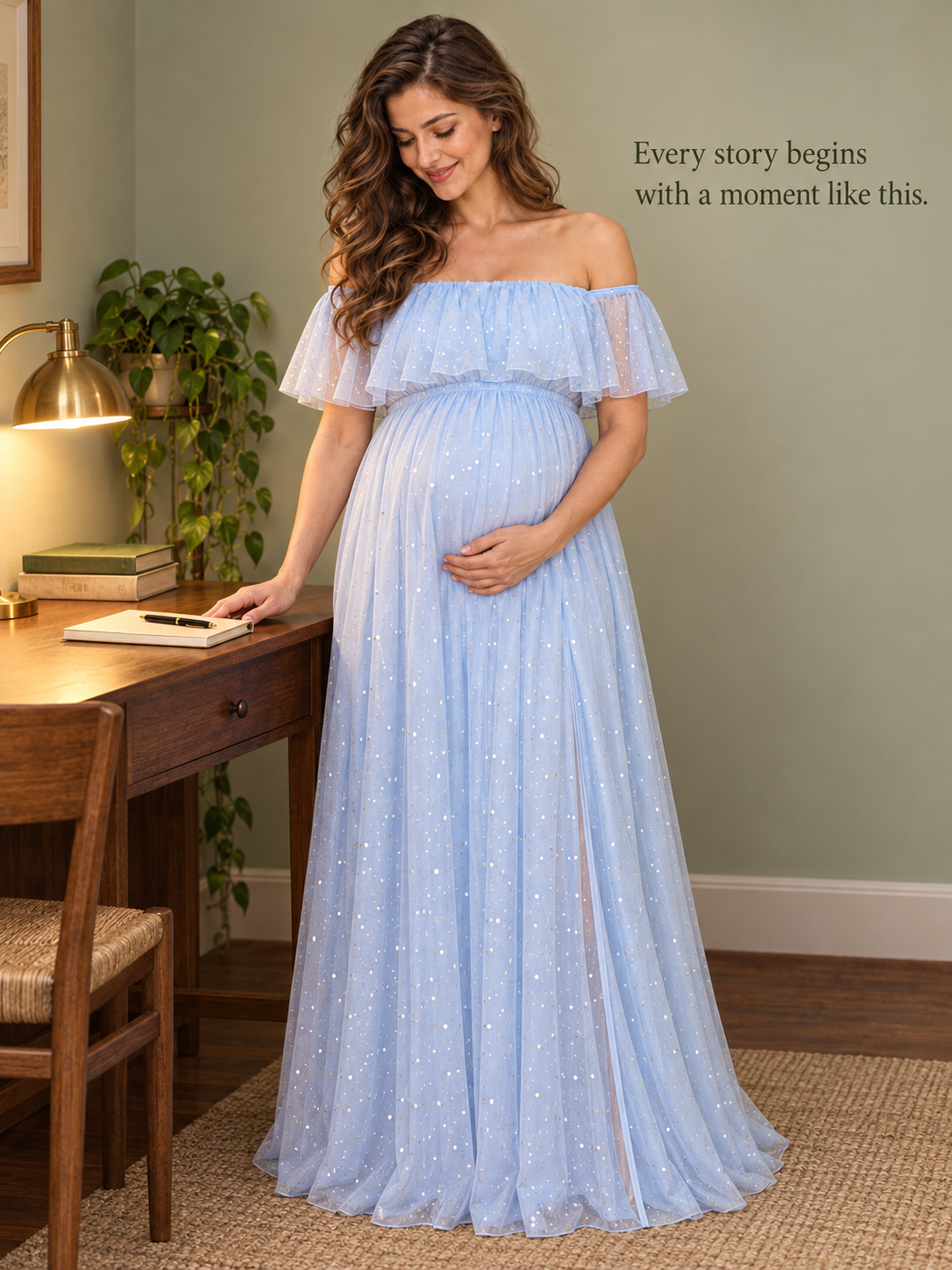 Odette Light Blue maternity dress — standing at a writing desk with a lamp