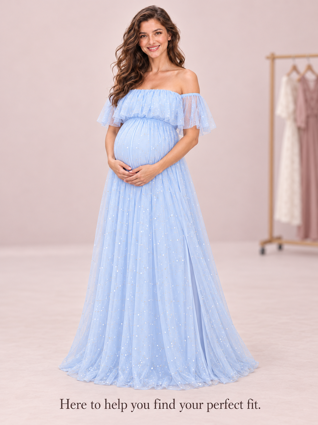 Odette Light Blue maternity dress — studio portrait beside a boutique clothing rail