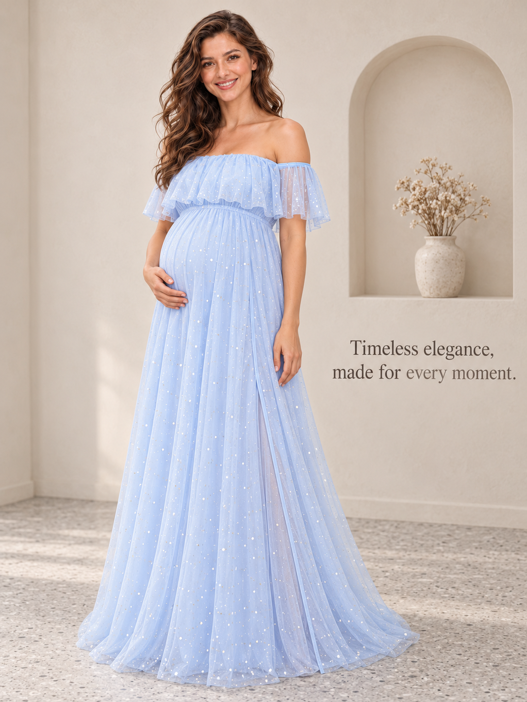 Odette Light Blue maternity dress — portrait beside an arched alcove with a vase