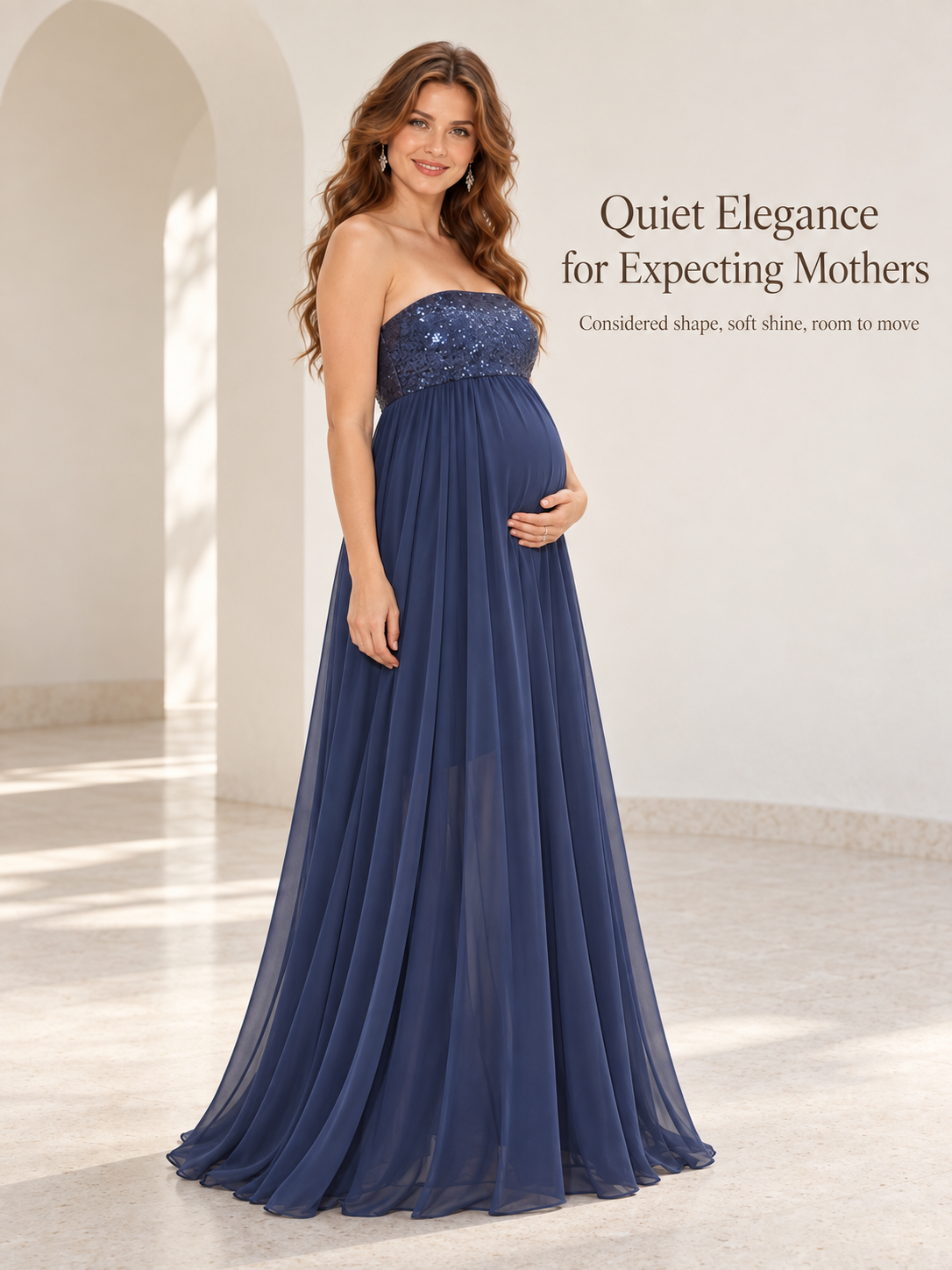 Josephine Navy maternity dress — standing portrait beneath soft archways