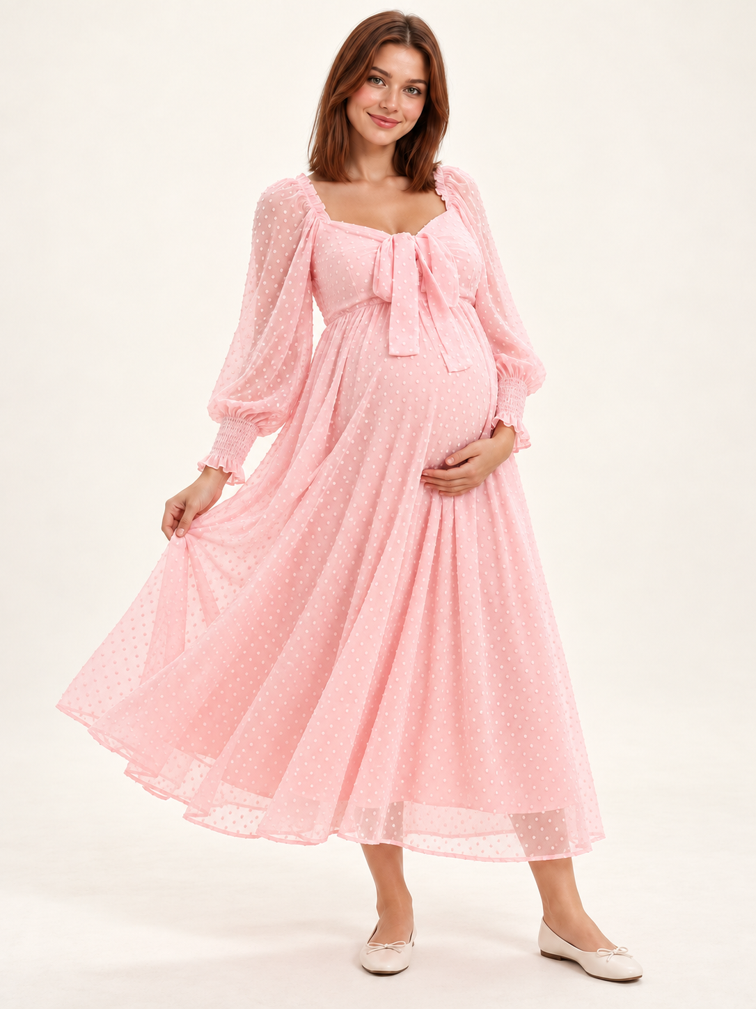 Emmeline Blush Pink maternity dress — flowing Swiss-dot skirt and hem in motion