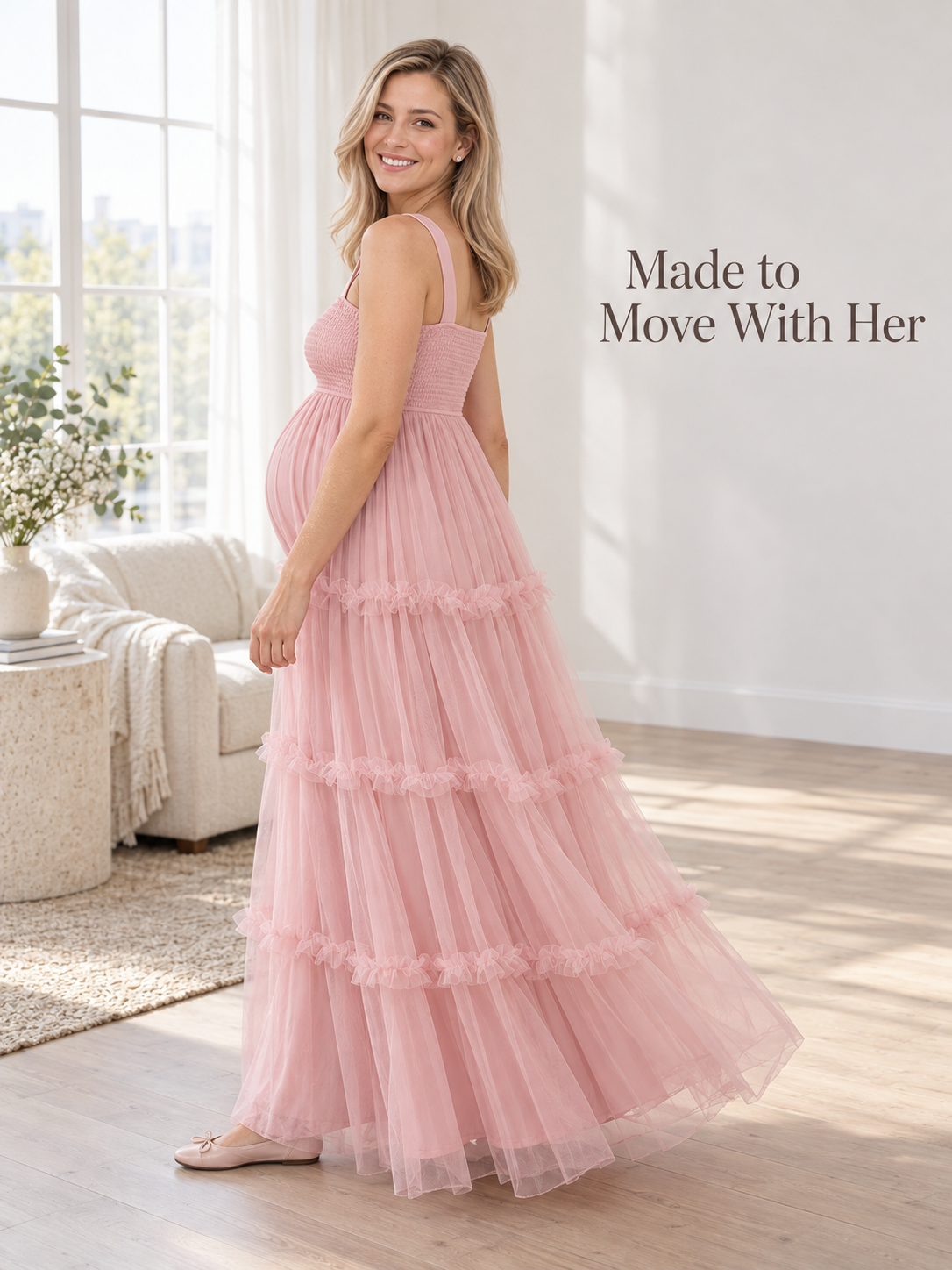 Lorelei Light Pink maternity dress — side view of the tiered skirt in a bright room