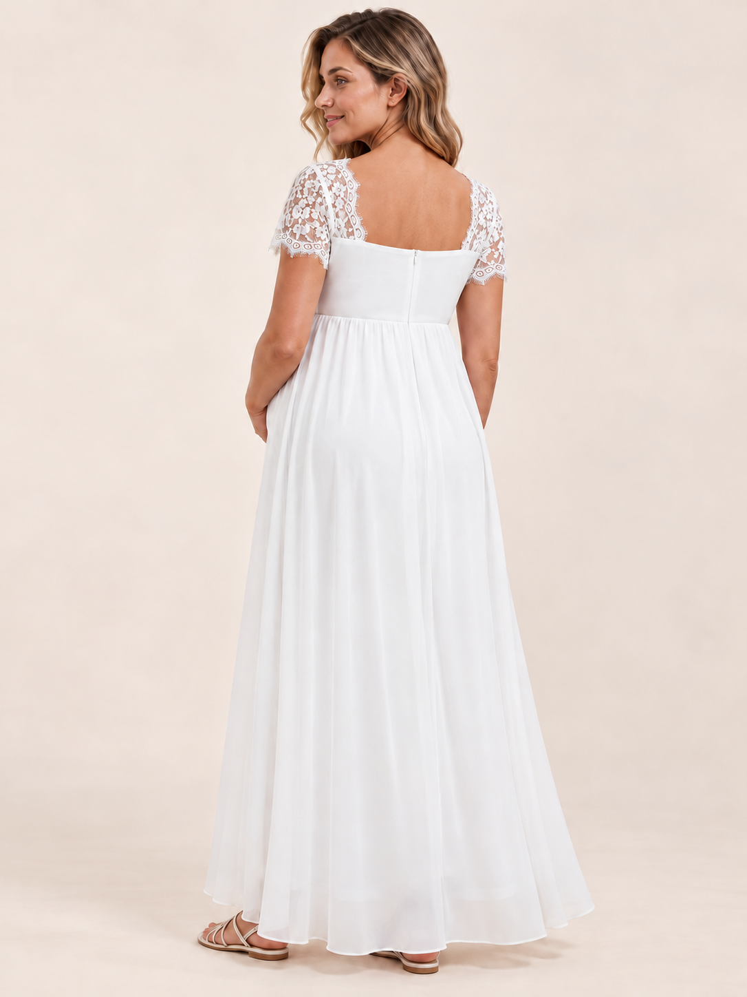 Madeleine White maternity dress — back view of the lace shoulders and flowing skirt