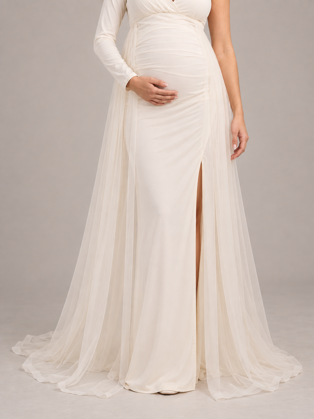 Aurelia Cream maternity dress — fitted skirt with front slit beneath the open tulle overskirt
