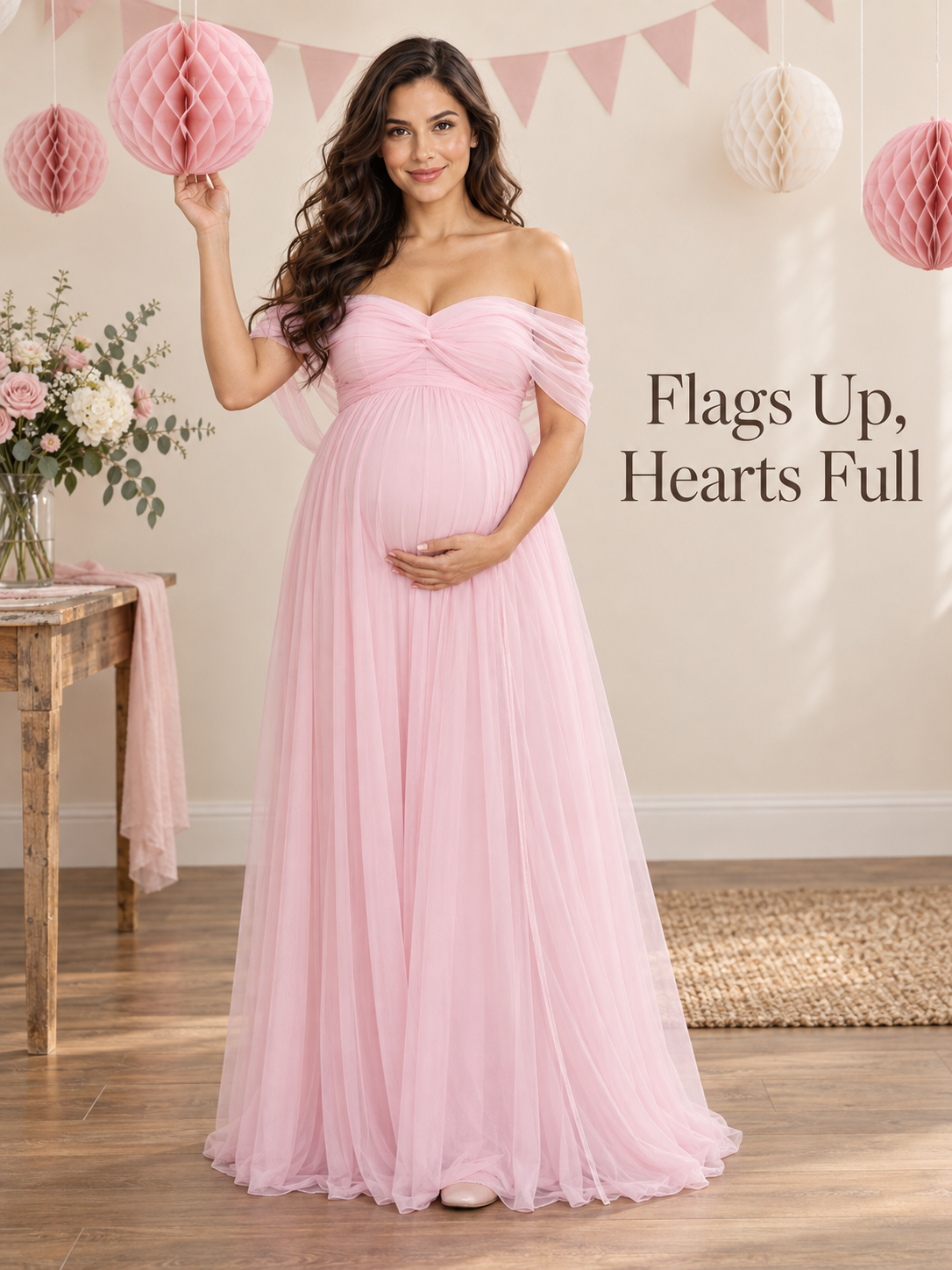 Orielle Light Pink maternity dress — celebrating under paper decorations and bunting
