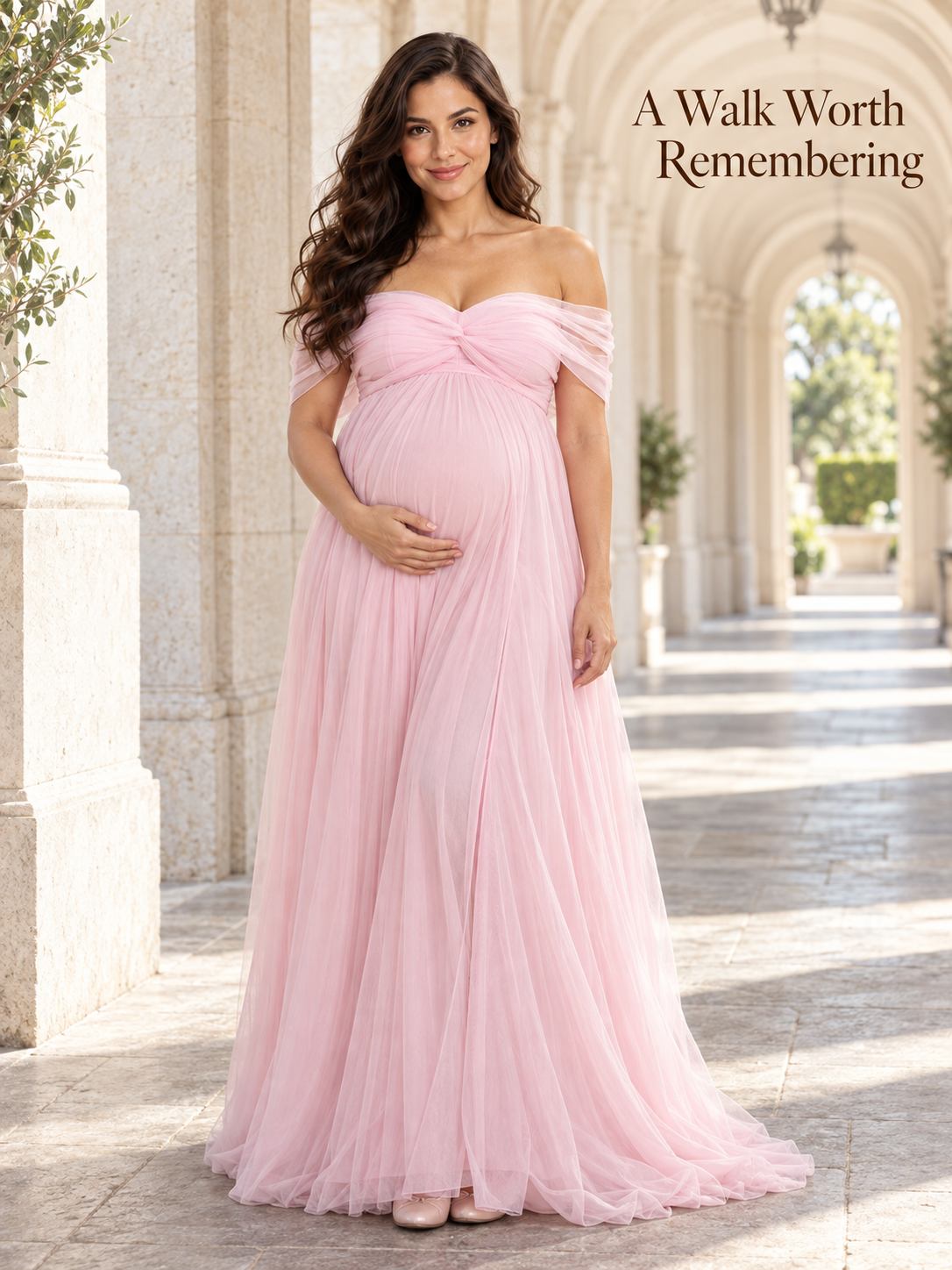 Orielle Light Pink maternity dress — walking through a sunlit arched colonnade