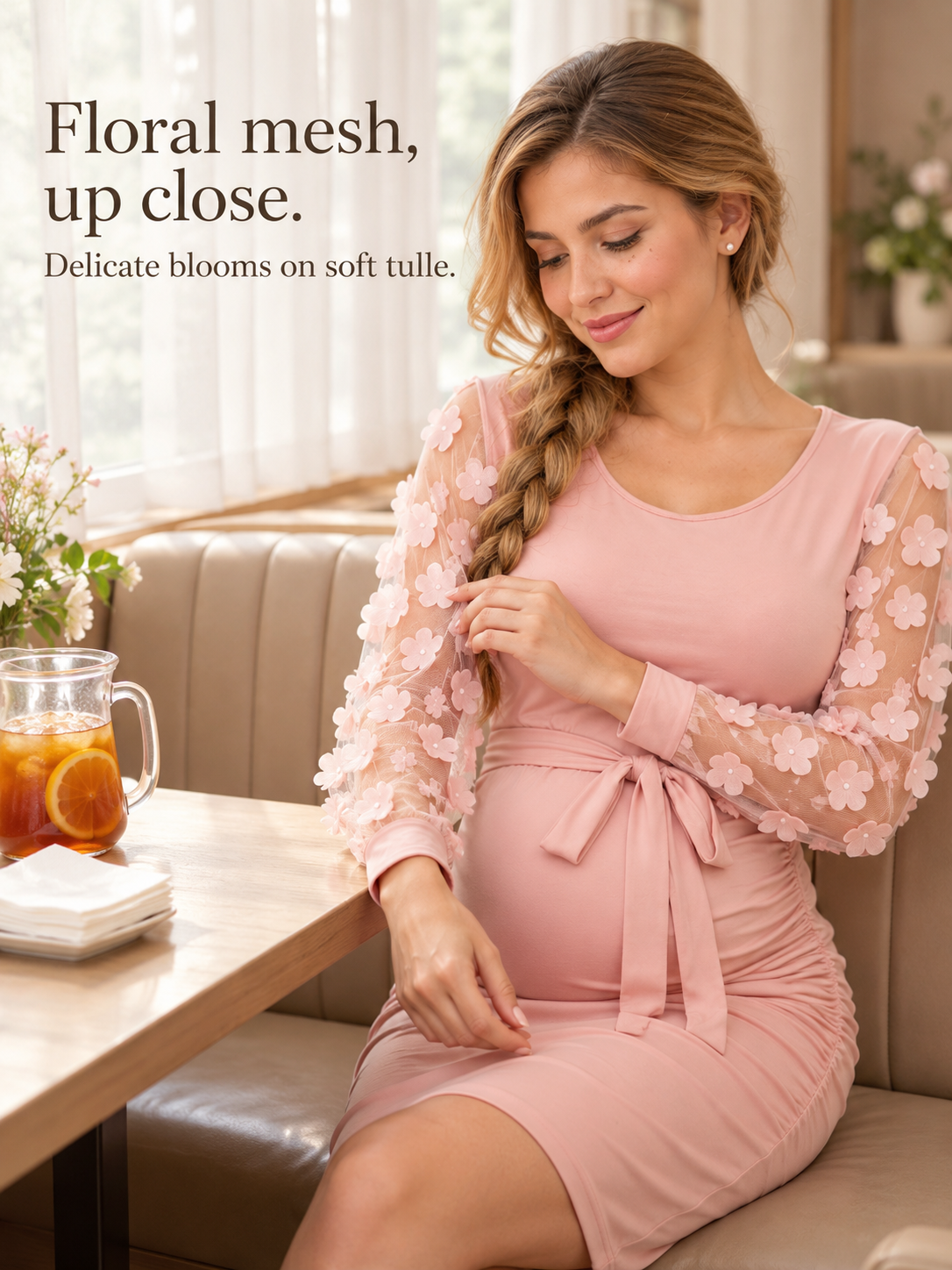 Beatrix Blush Pink maternity dress — seated in a café booth with a glass of iced tea