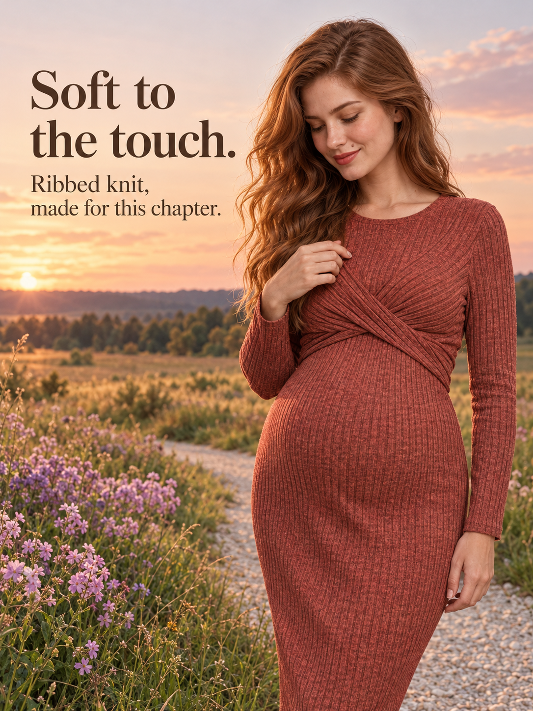 Maeve Rust Red maternity dress — touching the neckline in a golden-hour lavender field