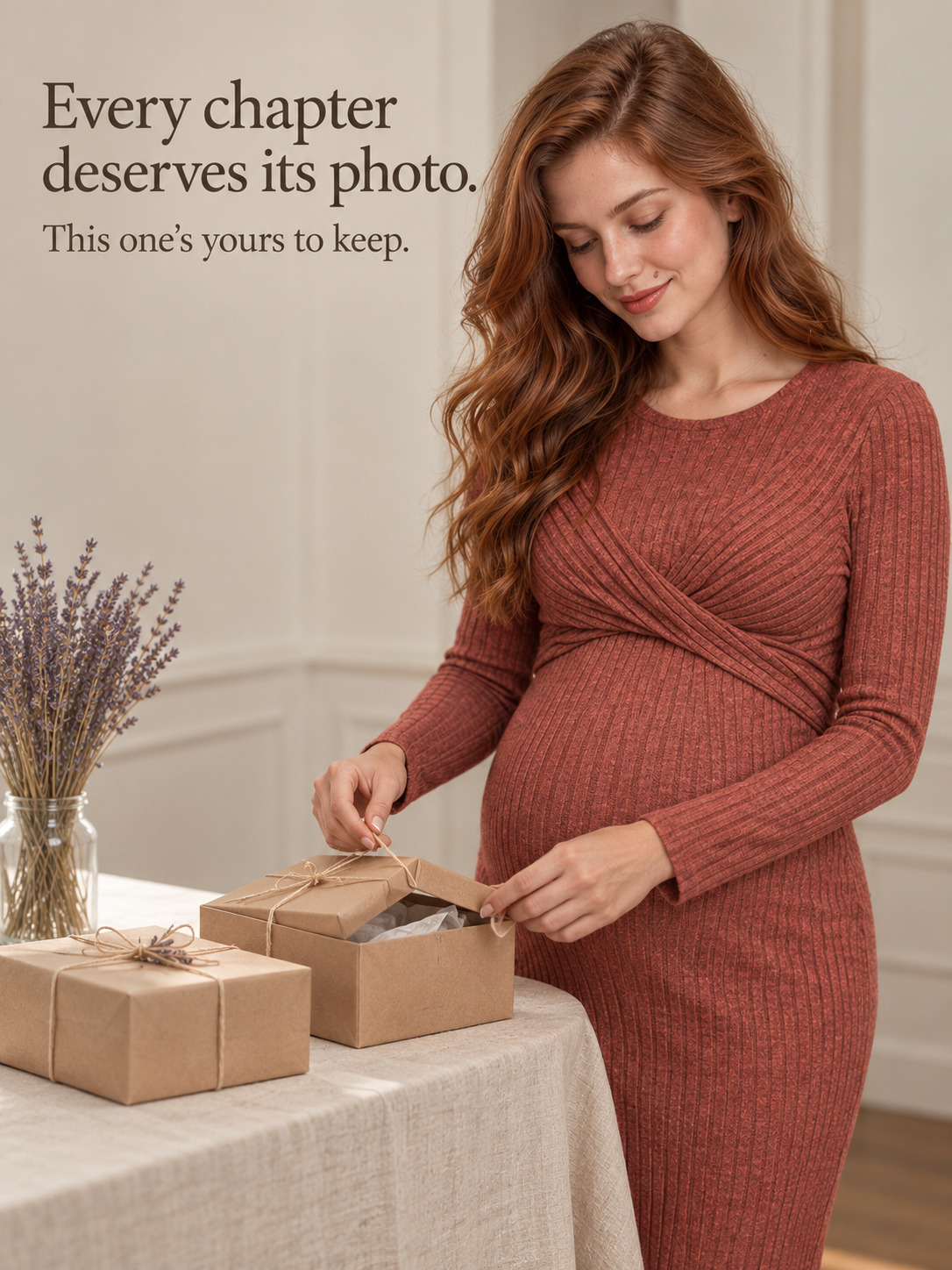 Maeve Rust Red maternity dress — opening a small gift box at a flower-filled table
