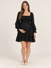 Penelope Black maternity dress — front view with square neckline, smocked bodice and ruffled mini skirt