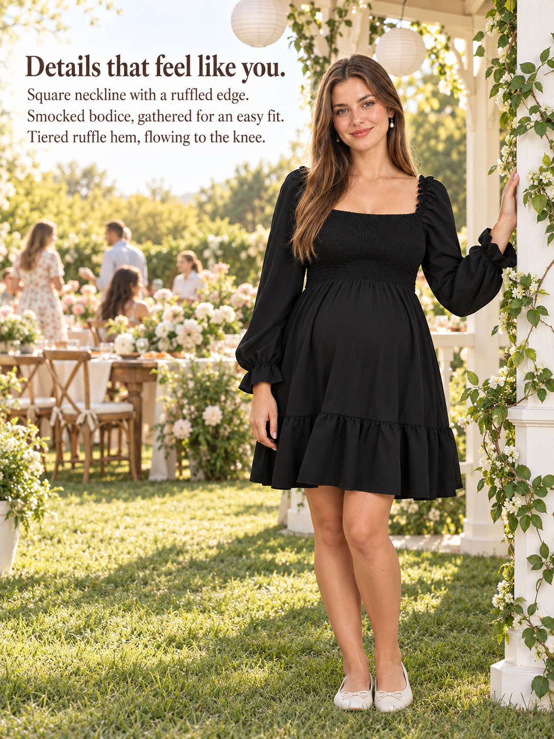 Penelope Black maternity dress — standing outdoors at an evening garden gathering with lanterns