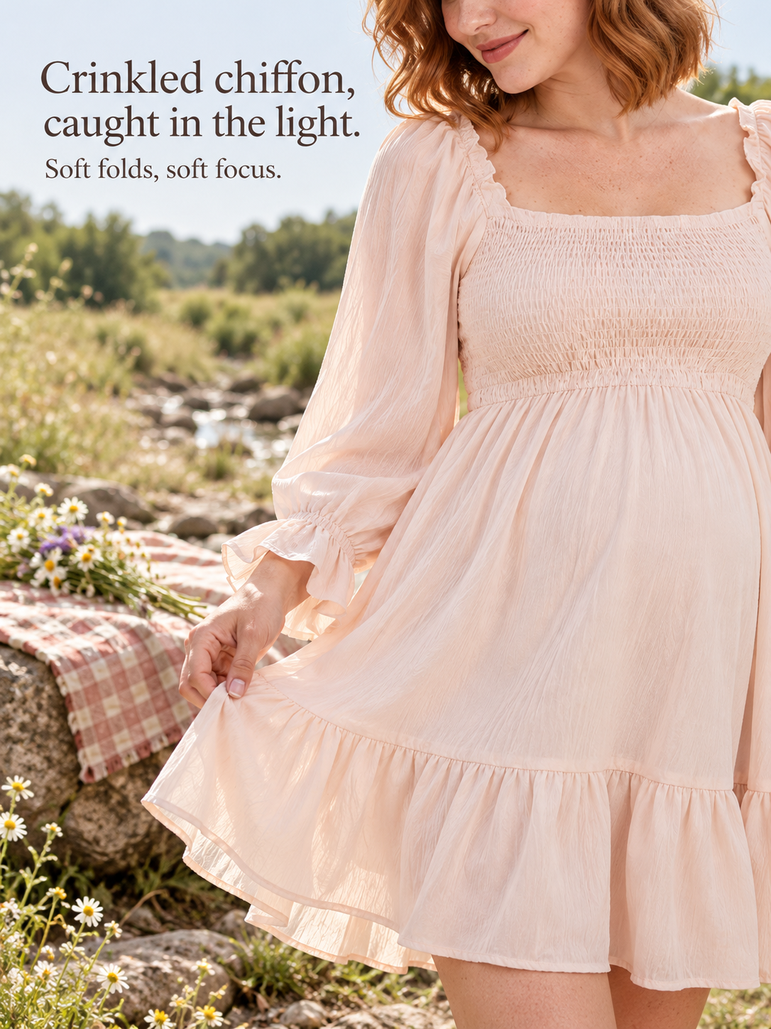 Penelope Pale Blush maternity dress — standing by a creek with a picnic blanket nearby