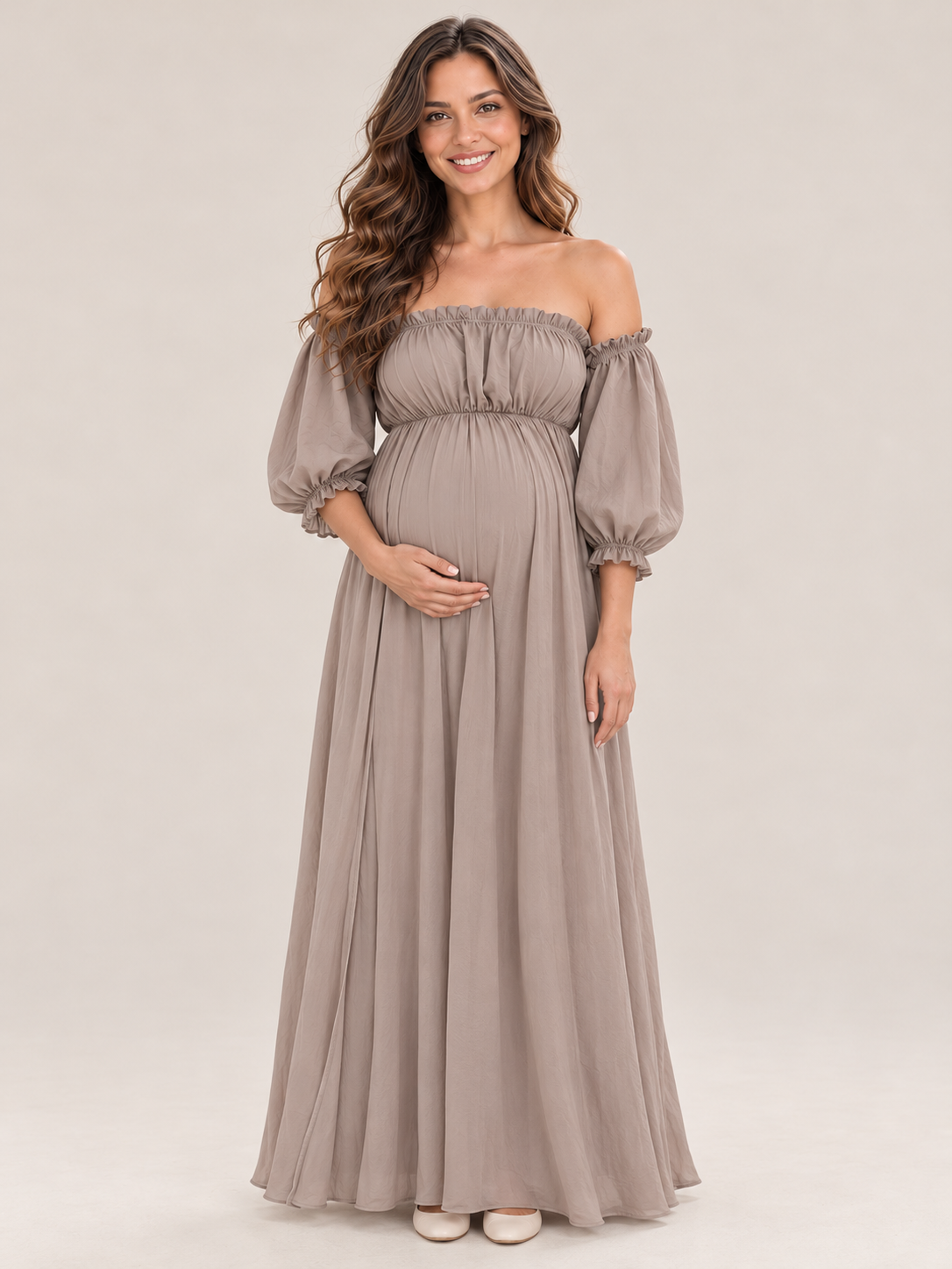 Elodie Taupe maternity dress — front view with ruffled off-shoulder neckline, puff sleeves and A-line maxi skirt