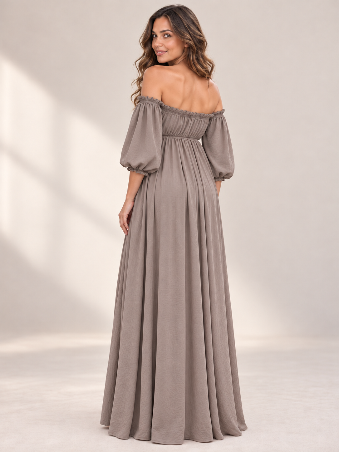 Elodie Taupe maternity dress — back view of the bare shoulders, gathered back panel and puff sleeves