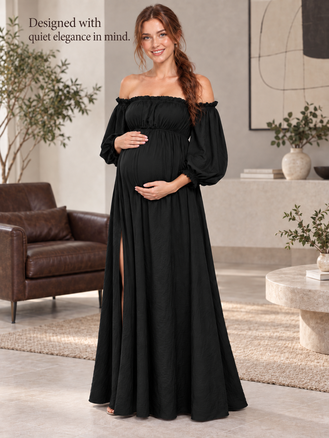 Elodie Black maternity dress — full-length view in a modern living room