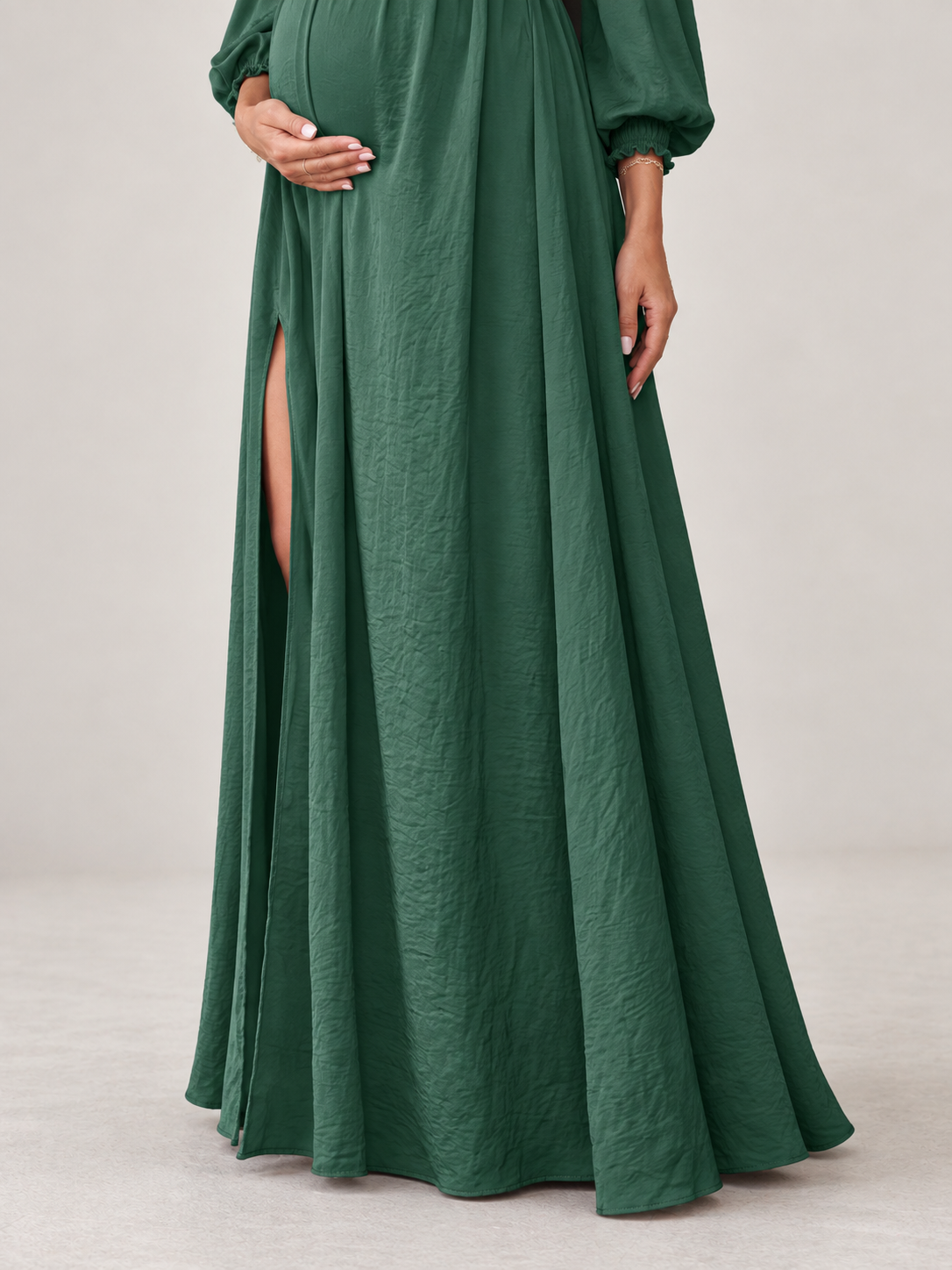 Elodie Forest Green maternity dress — flowing skirt with the high front slit and crinkle texture