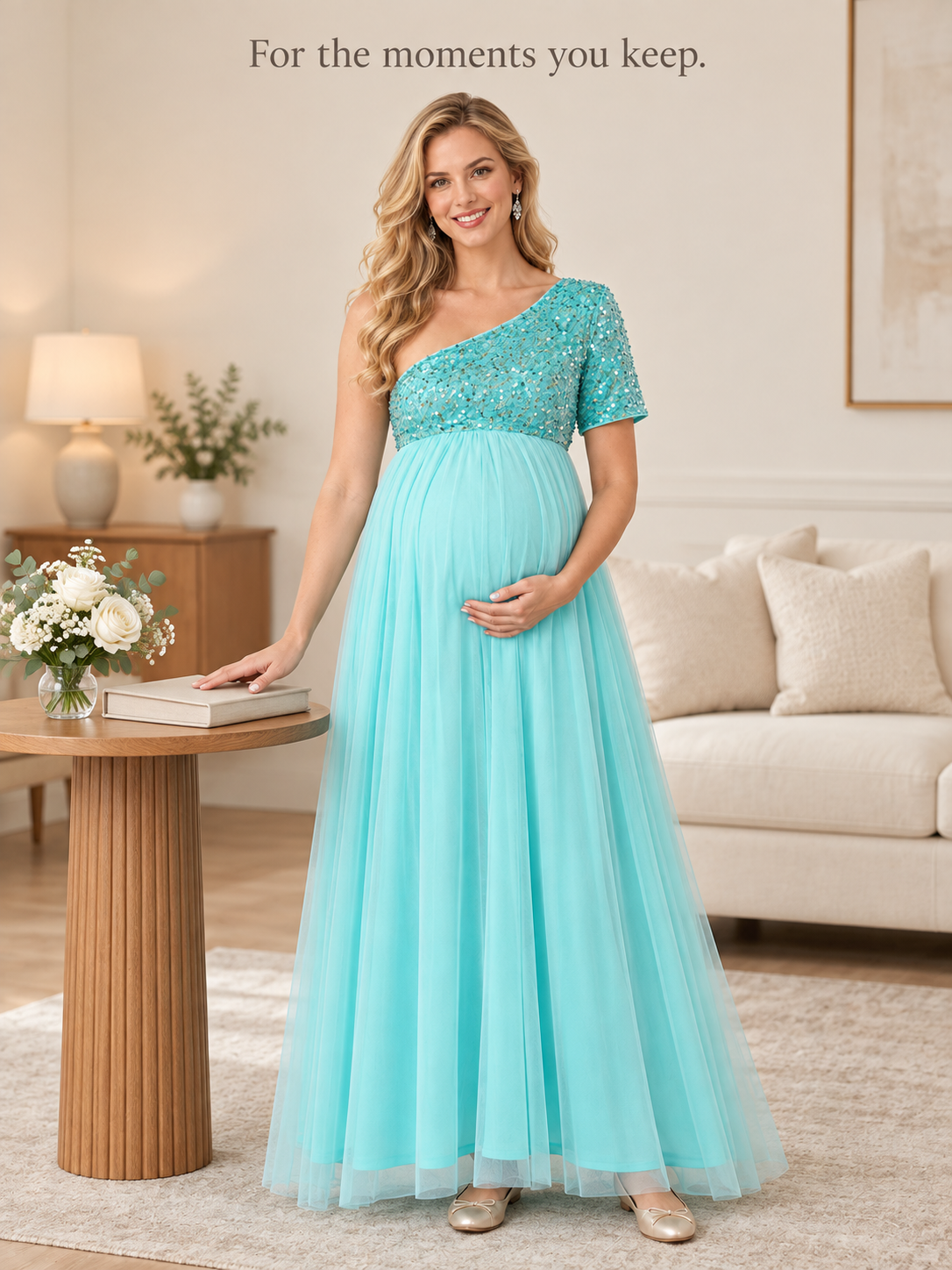 Rosalie Aqua maternity dress — standing beside a side table with flowers