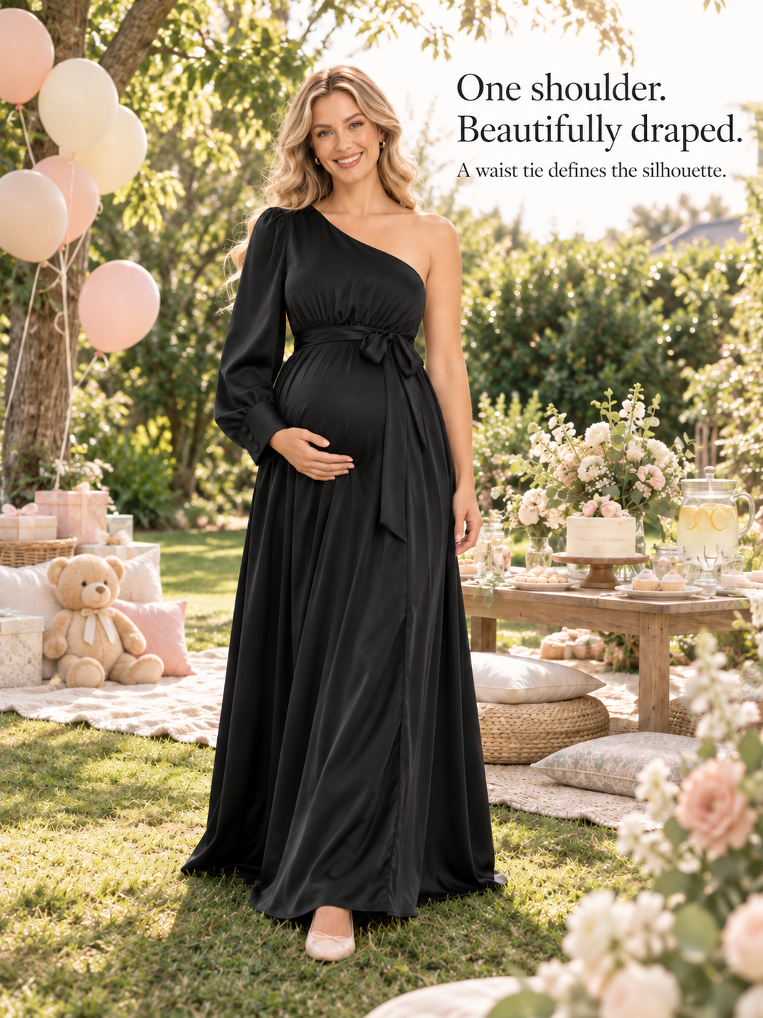 Sylvie Black maternity dress — standing on a garden lawn at a baby shower