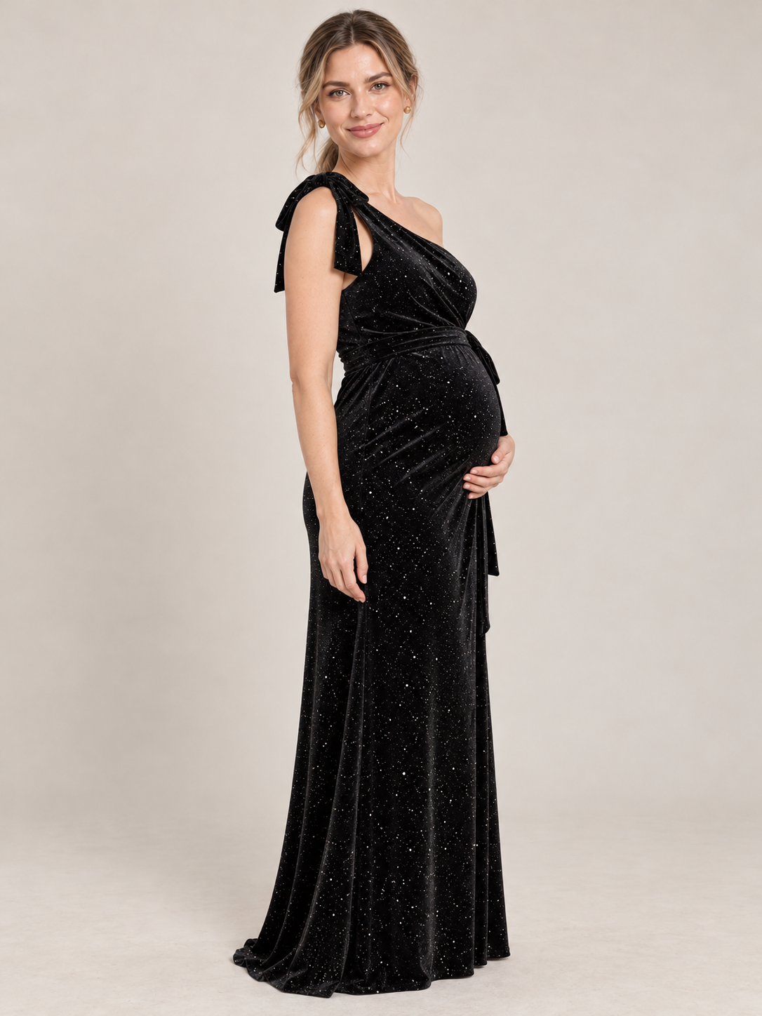 Ines Black maternity dress — side view of the slim silhouette over the bump