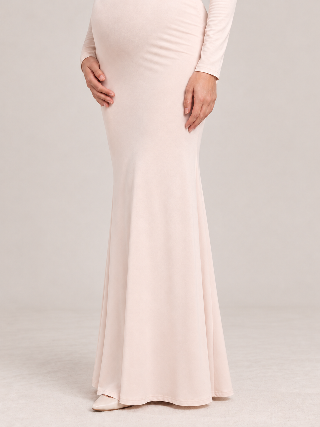Amelise Cream maternity dress — close-fitting skirt flaring softly toward the floor