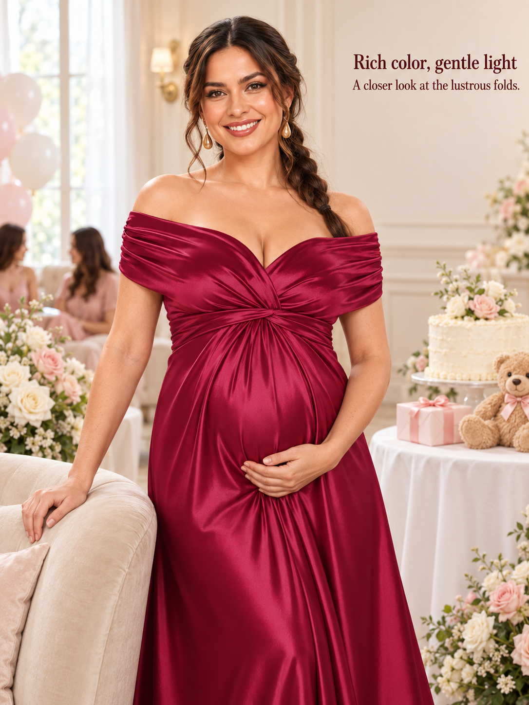 Cressida Wine Red maternity dress — half-length view leaning on a sofa arm at a baby shower