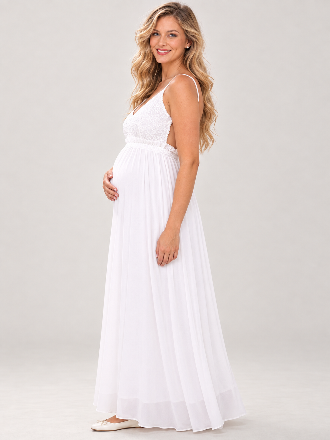 Alessia White maternity dress — side view of the open back and bump silhouette