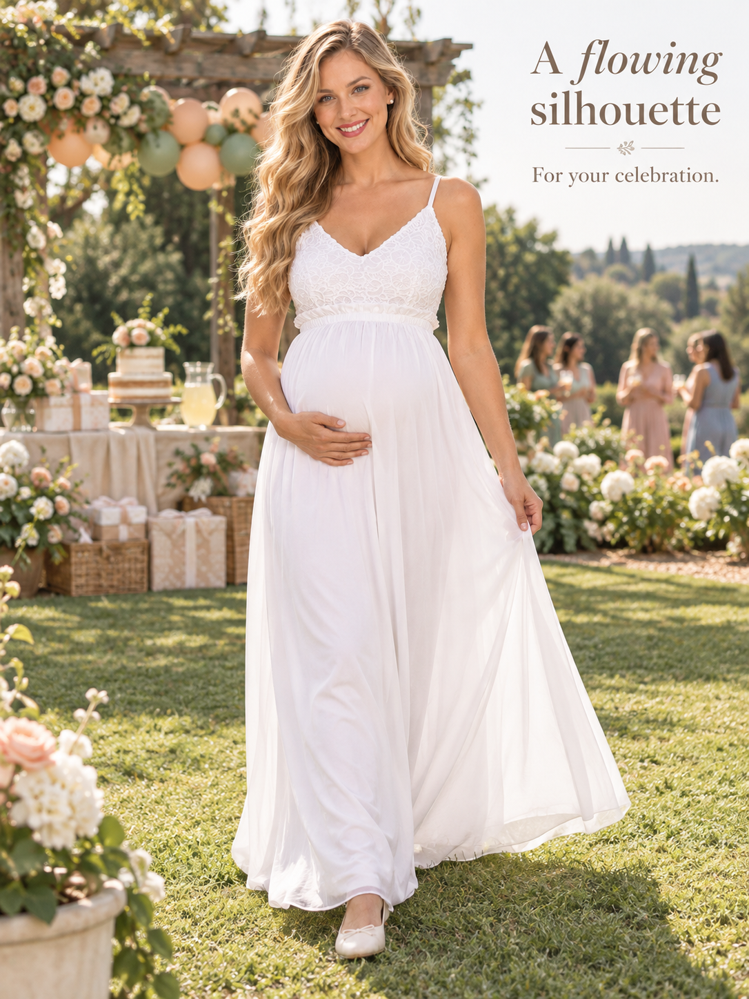 Alessia White maternity dress — walking across the lawn in a flowing silhouette
