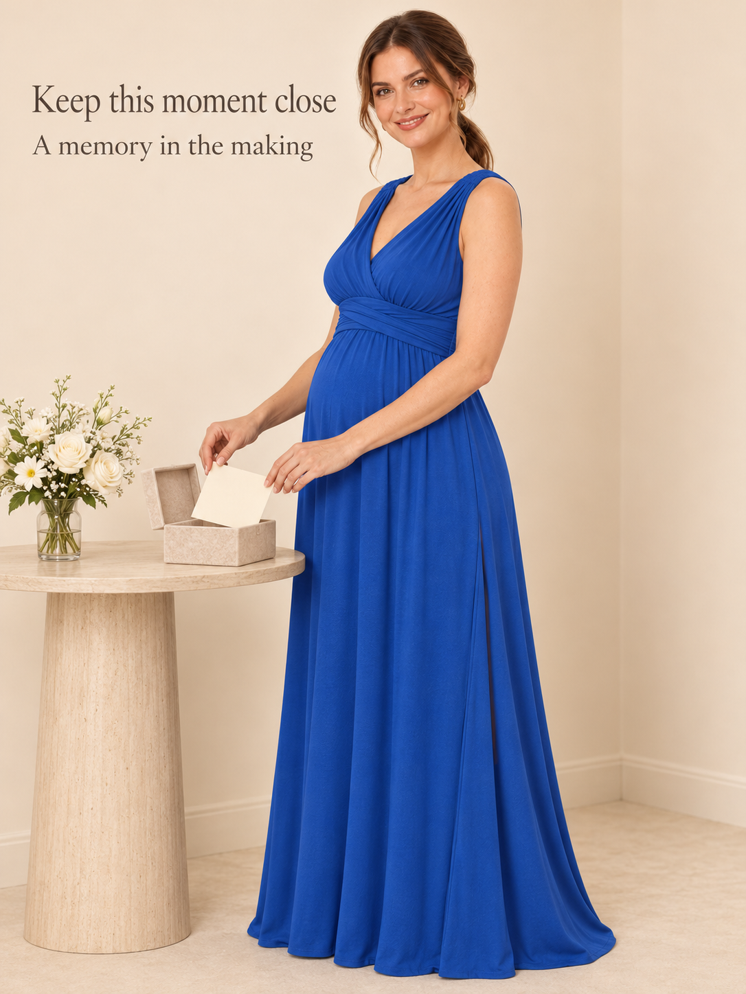 Amara Royal Blue maternity dress — placing a card in a keepsake box on a side table