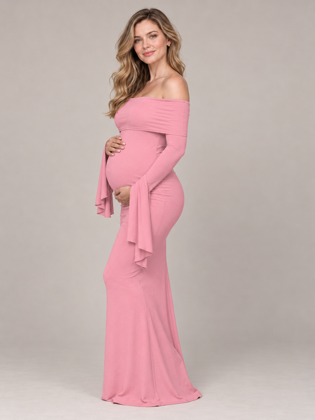 Arabella Rose maternity dress — front view with hand on the belly, fitted skirt