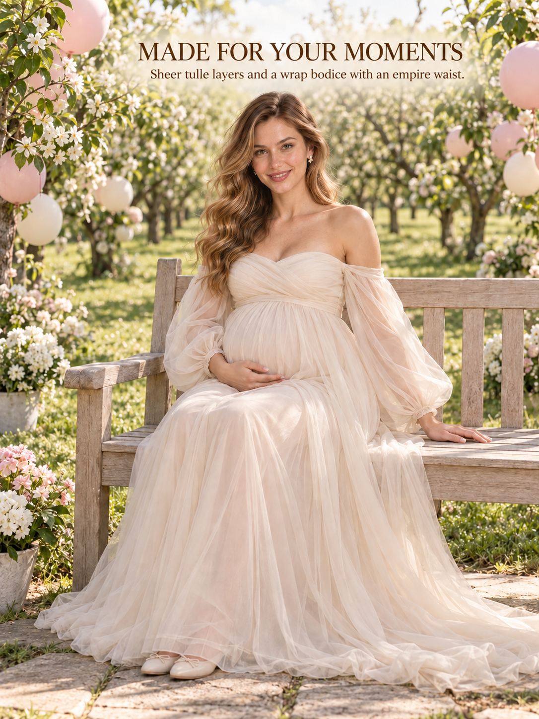 Anouk Champagne maternity dress — seated on a garden bench in a blossoming orchard