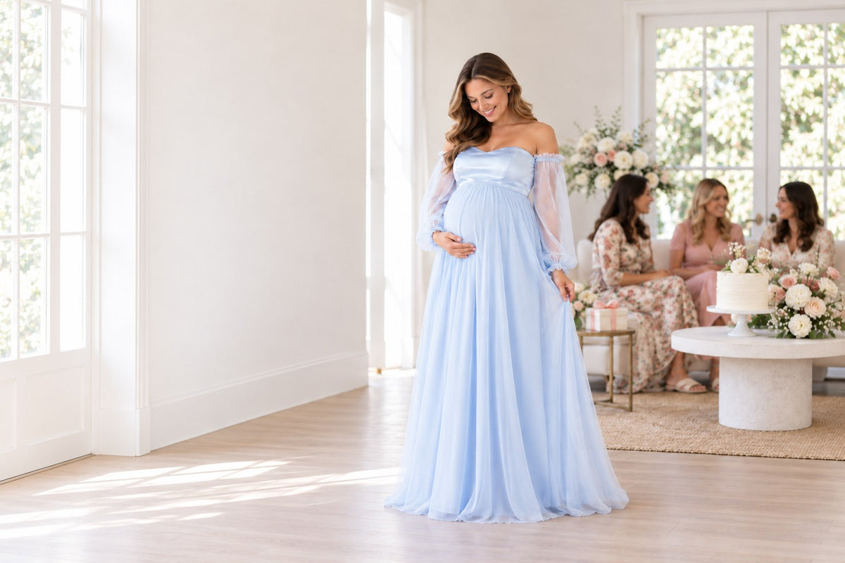 Mom-to-be in a sky blue off-shoulder maternity gown at a bright baby shower with friends and flowers