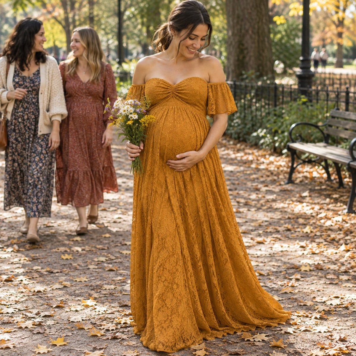 Mom-to-be in an antique gold lace dress holding wildflowers in an autumn park