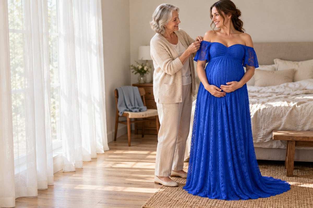 Mom-to-be in a royal blue lace maternity dress laughing with her mother on the morning of her baby shower