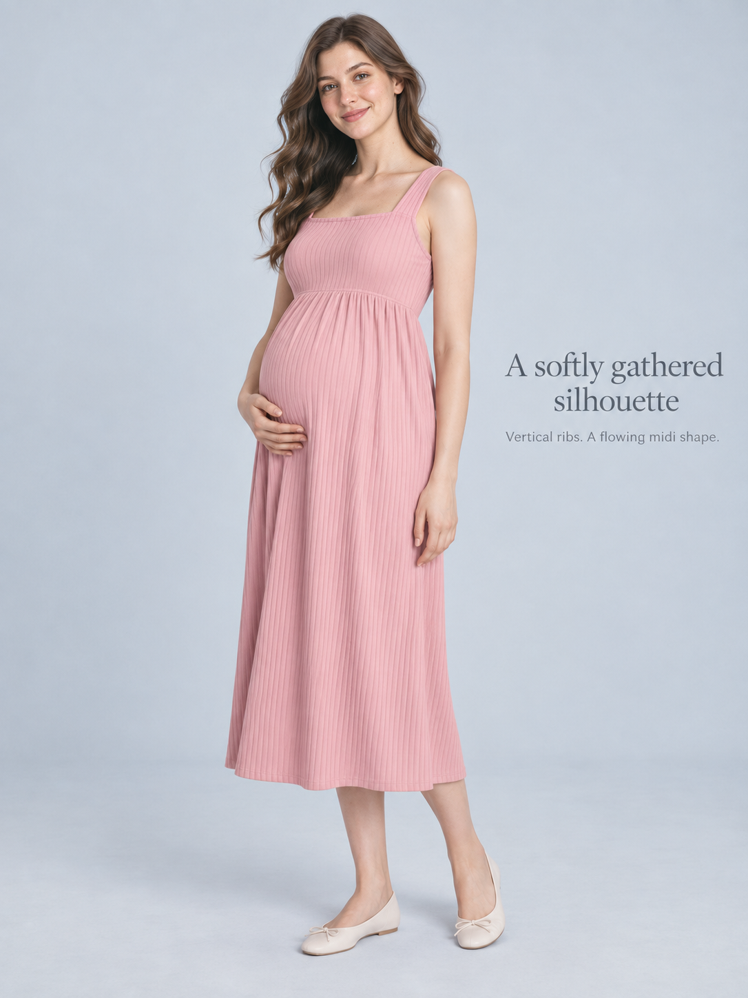 Marcella Blush Pink maternity dress — full-length studio view on a soft blue backdrop