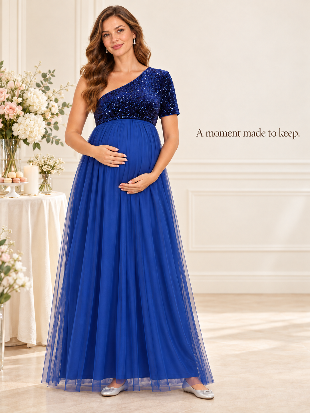 Rosalie Royal Blue maternity dress — standing beside flowers, candles and a dessert table