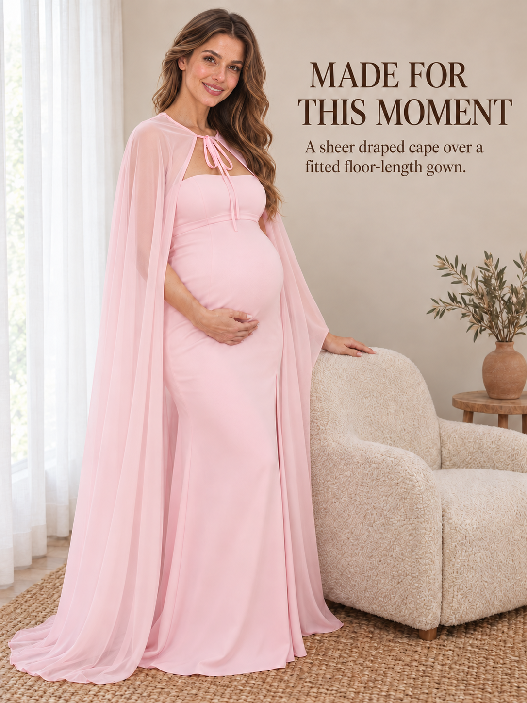 Rosamund Light Pink maternity dress — resting a hand on a soft armchair in a quiet room
